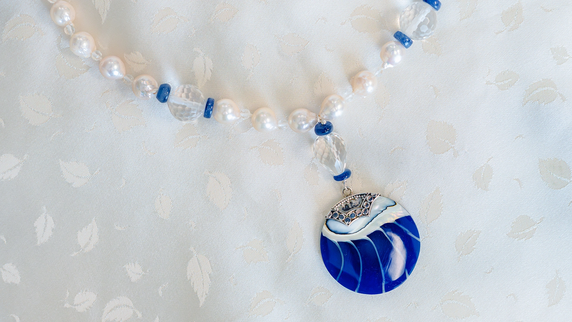 Handmade necklace with blue stone designed by Kathy Chan